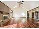 Bright living room boasts hardwood floors, skylights, and a charming brick fireplace at 5519 Fall Creek Rd, Indianapolis, IN 46220