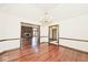 Spacious living room featuring hardwood floors and an open layout to other rooms at 5519 Fall Creek Rd, Indianapolis, IN 46220