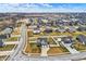 Established community with neatly arranged homes and manicured lawns, complemented by a tranquil backdrop at 61 Larimar Way, Whiteland, IN 46184