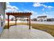 Spacious backyard featuring a pergola with a concrete patio, perfect for outdoor entertaining at 61 Larimar Way, Whiteland, IN 46184