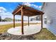 Spacious backyard featuring a pergola with a concrete patio, perfect for outdoor entertaining at 61 Larimar Way, Whiteland, IN 46184