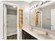 Bathroom with double sink vanity and open door to bathtub/shower combo at 61 Larimar Way, Whiteland, IN 46184