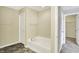 Bright bathroom featuring a soaking tub and a linen closet at 61 Larimar Way, Whiteland, IN 46184