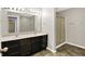 Bathroom with double sink vanity, large mirror, and glass-enclosed shower at 61 Larimar Way, Whiteland, IN 46184