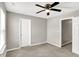Bedroom featuring a ceiling fan and two doors at 61 Larimar Way, Whiteland, IN 46184