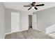 Bright bedroom featuring a ceiling fan and two doors at 61 Larimar Way, Whiteland, IN 46184