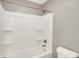 Bathtub and shower combo with shelving in the wall at 61 Larimar Way, Whiteland, IN 46184