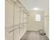Walk-in closet with wire shelving and carpeted floor at 61 Larimar Way, Whiteland, IN 46184