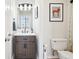 Modern bathroom featuring a vanity with stylish fixtures and artwork at 611 N Park Ave # 414, Indianapolis, IN 46204