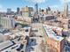Aerial view featuring a street and buildings amid a backdrop of the modern city skyline at 611 N Park Ave # 414, Indianapolis, IN 46204