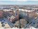 Aerial view showcases the brick building's unique architectural details and surrounding cityscape at 611 N Park Ave # 414, Indianapolis, IN 46204