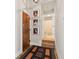 Hallway with pictures, interior door, and bathroom in a bright, modern condominium at 611 N Park Ave # 414, Indianapolis, IN 46204