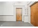 Hallway with unit numbers outside of doors on carpeted floor at 611 N Park Ave # 414, Indianapolis, IN 46204