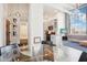 Bright condo kitchen and living area with stainless steel appliances, exposed brick, and large window at 611 N Park Ave # 414, Indianapolis, IN 46204