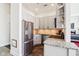 Modern kitchen with stainless steel appliances and sleek cabinets, and tile floors at 611 N Park Ave # 414, Indianapolis, IN 46204