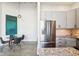 Open kitchen with stainless steel appliances and granite countertops at 611 N Park Ave # 414, Indianapolis, IN 46204