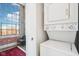 Convenient laundry closet next to bedroom with stacked washer-dryer and city view at 611 N Park Ave # 414, Indianapolis, IN 46204