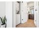Efficient laundry area with stacked washer and dryer, next to a bathroom at 611 N Park Ave # 414, Indianapolis, IN 46204