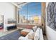Bright living room featuring large windows, comfortable seating, and modern décor at 611 N Park Ave # 414, Indianapolis, IN 46204