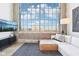Cozy living room with city view from large windows, comfortable sectional sofa and decor at 611 N Park Ave # 414, Indianapolis, IN 46204