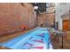 Indoor pool with brick walls and steel beam, featuring a distinctive patterned design at 611 N Park Ave # 414, Indianapolis, IN 46204