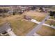Aerial view of the property featuring a well-maintained lawn, pool, and outbuilding at 6880 W Jennifer Dr, Greenfield, IN 46140
