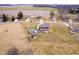 Aerial view of the home and surrounding area, showcasing a large yard, pool, and storage barn at 6880 W Jennifer Dr, Greenfield, IN 46140