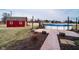 Large backyard with barn, above-ground pool, concrete patio, and mature trees at 6880 W Jennifer Dr, Greenfield, IN 46140