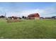 Expansive backyard featuring a well-maintained lawn, storage barn, and above-ground swimming pool at 6880 W Jennifer Dr, Greenfield, IN 46140