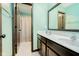 Bathroom with dual sinks, a large mirror, and a shower-tub combination at 6880 W Jennifer Dr, Greenfield, IN 46140