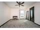 Bright bedroom with carpet flooring, ceiling fan, and a large window for natural light at 6880 W Jennifer Dr, Greenfield, IN 46140
