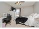 Bedroom with neutral gray walls, a plush bed, carpet flooring and a white desk at 6880 W Jennifer Dr, Greenfield, IN 46140