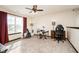 Bright bedroom space with a large window, ceiling fan, and ample room for activities at 6880 W Jennifer Dr, Greenfield, IN 46140