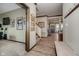 Open-concept foyer with wood floors, decorative art, staircase, and view into adjacent rooms at 6880 W Jennifer Dr, Greenfield, IN 46140