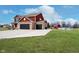 Spacious two-story home with brick facade, attached garage, in-ground pool, and red barn at 6880 W Jennifer Dr, Greenfield, IN 46140