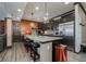 Kitchen featuring a granite island, stainless steel appliances, and dark cabinetry at 6880 W Jennifer Dr, Greenfield, IN 46140