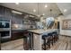 Kitchen featuring an island with bar stool seating, granite countertops and stainless appliances at 6880 W Jennifer Dr, Greenfield, IN 46140