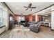 Cozy living room featuring luxury vinyl plank flooring, stylish sofas, and a ceiling fan at 6880 W Jennifer Dr, Greenfield, IN 46140