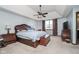 Inviting main bedroom with a trey ceiling, a ceiling fan, and dark wood furniture at 6880 W Jennifer Dr, Greenfield, IN 46140