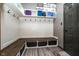 Well-organized mudroom with hooks, storage, a bench, and easy access to the home at 6880 W Jennifer Dr, Greenfield, IN 46140