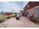 Cozy backyard patio with string lights, seating, and view of the above ground pool at 6880 W Jennifer Dr, Greenfield, IN 46140