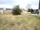 Large backyard with mature trees and a patio, offering ample space for outdoor activities at 6896 Maywood Cir, Avon, IN 46123