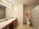 Traditional bathroom featuring a single sink vanity and tub with a shower at 6896 Maywood Cir, Avon, IN 46123