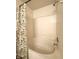 A bright white bathtub featuring tiled walls and a shower at 6896 Maywood Cir, Avon, IN 46123