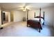 Large main bedroom with four-poster bed, walk-in closet, and private bathroom at 6896 Maywood Cir, Avon, IN 46123