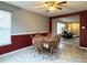 Inviting dining room with table set for six and open view to living space at 6896 Maywood Cir, Avon, IN 46123