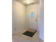 Clean entryway with a neutral palette and a door that has a stained glass window at 6896 Maywood Cir, Avon, IN 46123