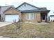 Charming brick home featuring a two-car garage and inviting front porch at 6896 Maywood Cir, Avon, IN 46123