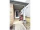 Cozy front porch area featuring a classic rocking chair and a porch light at 6896 Maywood Cir, Avon, IN 46123