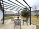 Cozy patio featuring a table and chairs under a modern pergola in a spacious backyard at 6896 Maywood Cir, Avon, IN 46123
